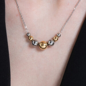 Collana donna in acciaio e IP gold e sfere