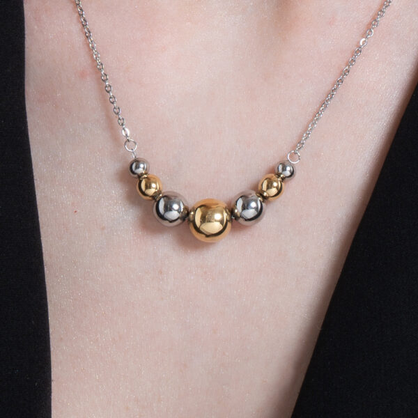 Collana donna in acciaio e IP gold e sfere