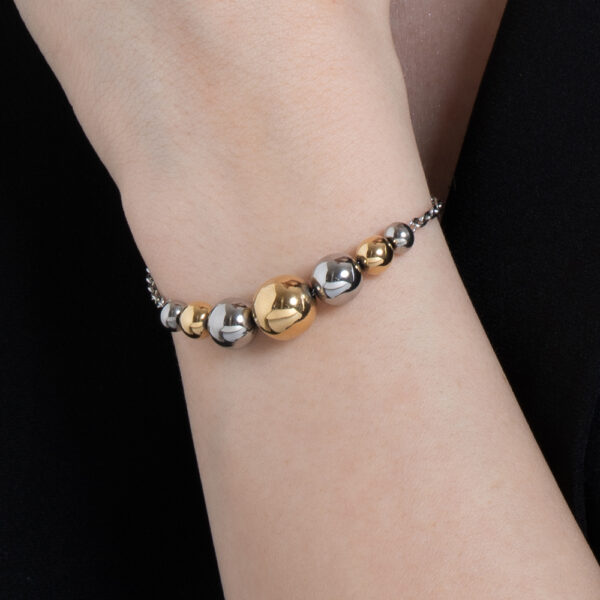 Bracciale donna in acciaio e IP gold con sfere